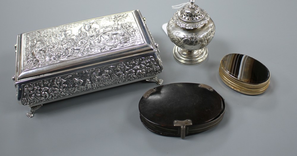 A George IV silver pepperette, a continental repousse white metal trinket box,